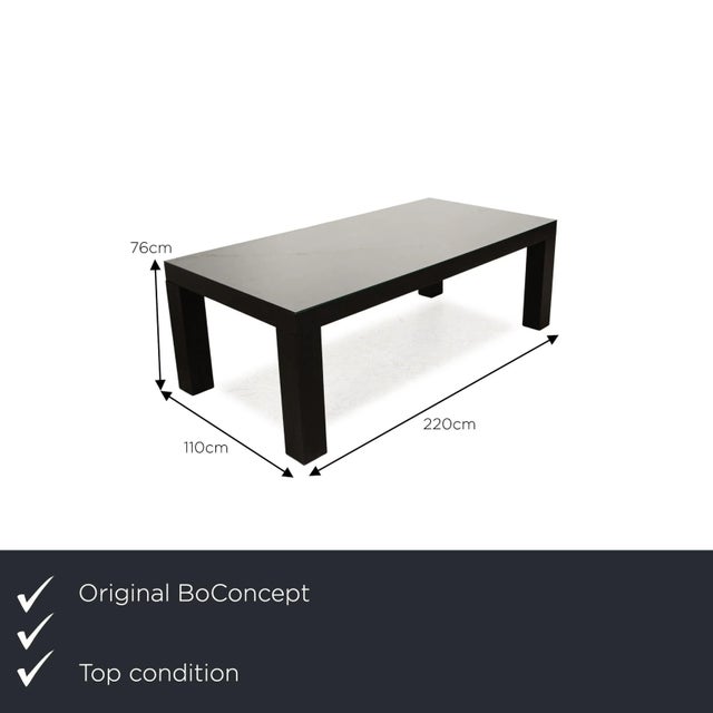 The dining table from BoConcept consists of a black wooden frame and a glass top.&nbsp; It impresses with its simple,...