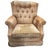 This 1970 armchair features a classic 20th century silhouette with a high, tufted back and rolled armrests all resting on...