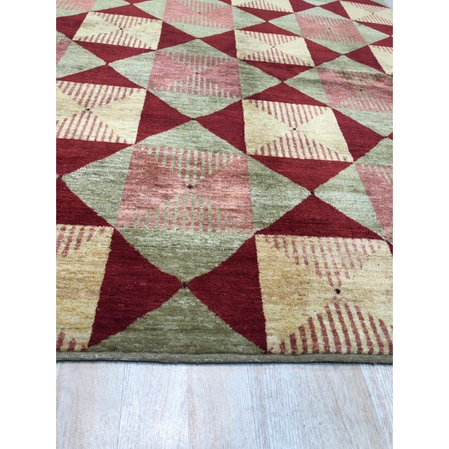 Hand-knotted in premium Afghan wool, this 9 x 12 Sloane Diamond rug carpet is a refined addition to our contemporary room-...