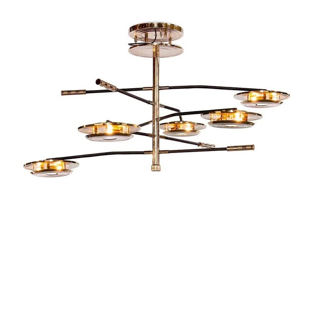 With a shape that was inspired by a golden vinyl player, Hendrix suspension lamp is a tribute the American rock guitarist,...