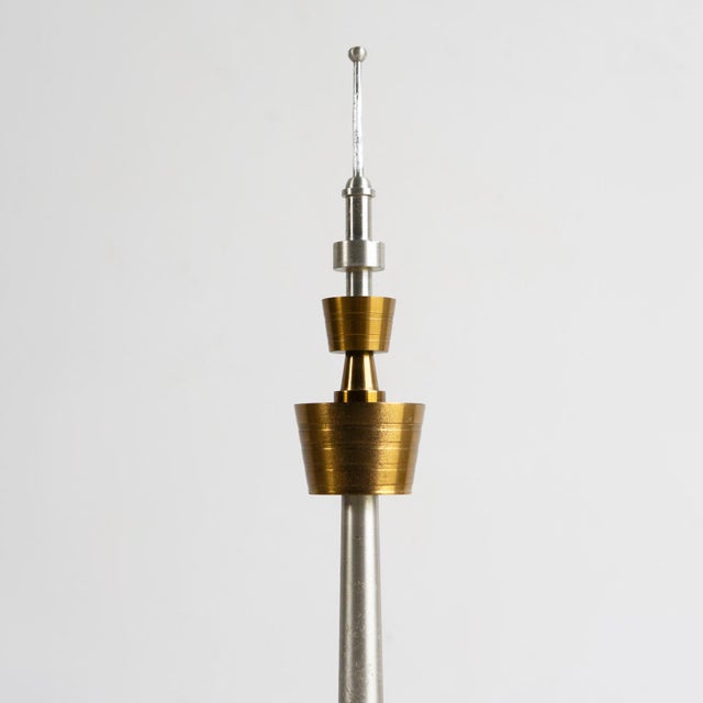 MID CENTURY TV TOWER MODEL A good quality and stylish space age model made from aluminium and gilt brass with a circular...