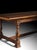 Handcrafted in Italy from solid walnut, this Venetian dining table features a matched veneer top accented by an antique...