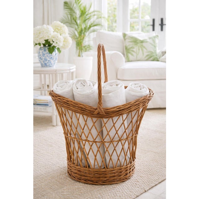 beautifully crafted vintage wicker basket featuring an elegant open lattice weave and gracefully arched double rim. The...