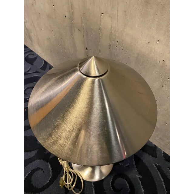 Fun vintage postmodern brushed stainless steel table lamp. In the style of Holtkoetter. It is not marked. The harp is...