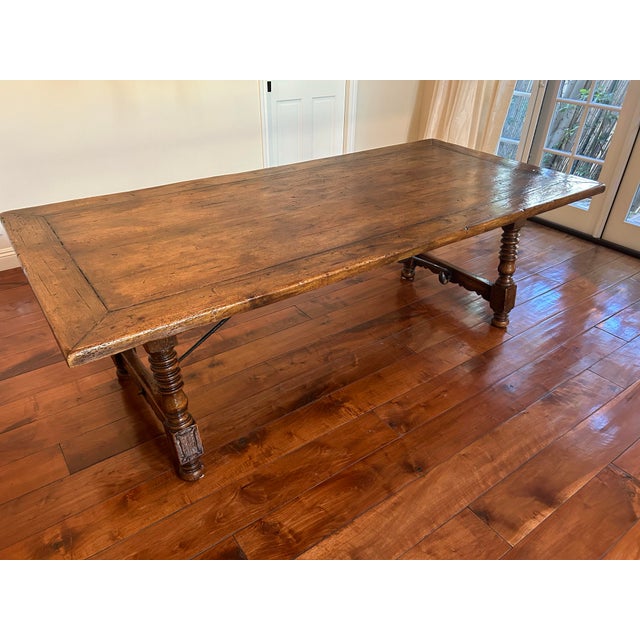 French Walnut Farmhouse Table, consisting of old and new wood, wrought iron base, beautiful patina of burl walnut.