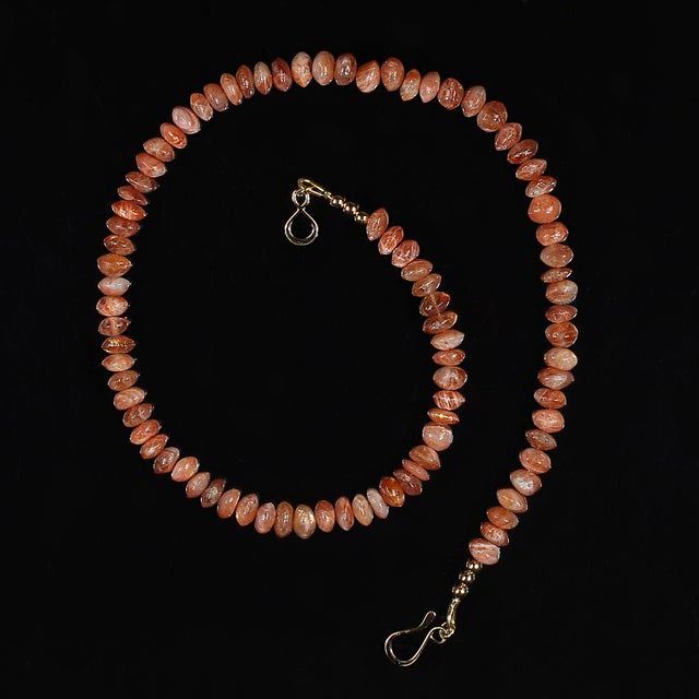 This 16‑inch Sunstone rondel necklace glows with natural warmth, featuring smooth, rounded 7 mm flat rondels that shimmer...