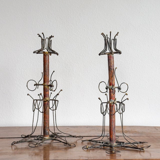 Pair of incredible handcrafted taper candle holders. Constructed from welded metal components.