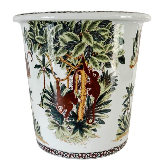 Beautiful porcelain cachepot jardiniere in a whimsical chinoiserie design with a vibrant, multi-tonal wrap-around scene of...