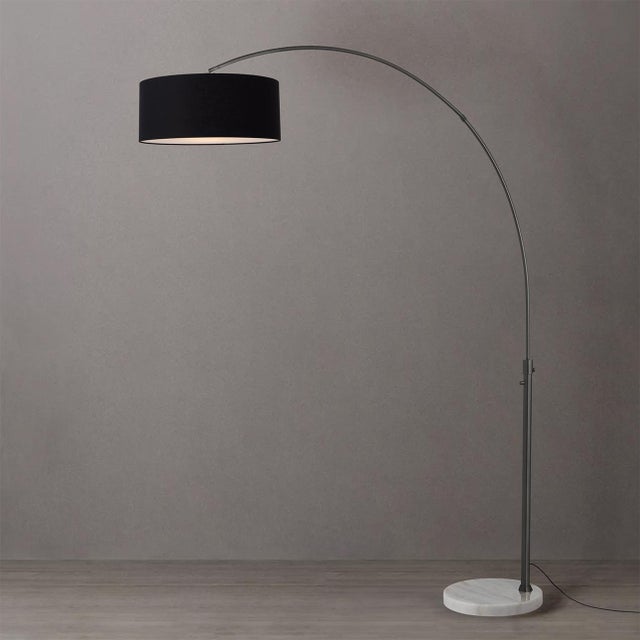 The lamp that lights a whole seating area without a single hole in your ceiling. The Float Arc Lamp is a Peter Morelli-...