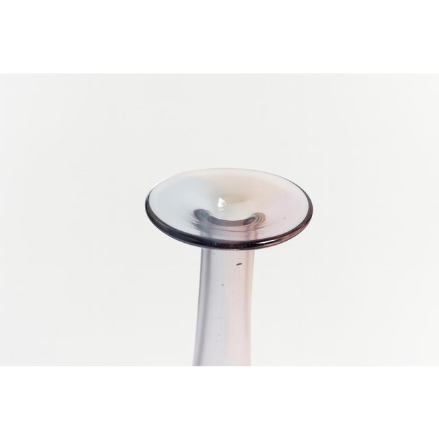 This elegant vase from Kjell Engman’s Fidji series shimmers with hues of blue, lilac, and pink. The gently swelling body...