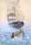 Noble nautical scene of a small rowboat coming to shore from a larger sailing vessel by George A. Robbins (American,...