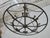Crafted in France circa 1920–1930, this striking iron chandelier combines industrial strength with refined decorative...