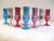 Colorful set of eight multicolor Carnival Cruise "Loving Cup" metallic cordial/shot glasses with silver metallic interior.