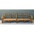 This vintage sofa frame is a long, low study in bent rattan, built as a two-section sectional with a lattice-style back...