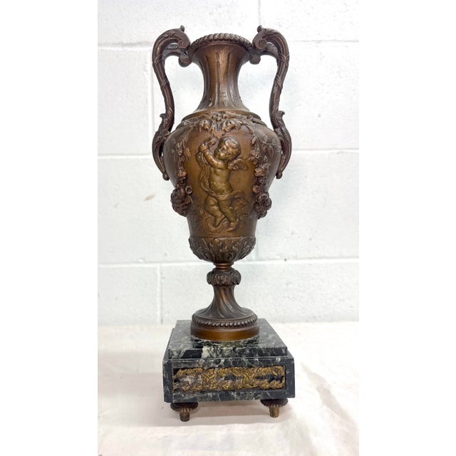 This lovely antique ornate bronze patinated Victorian ewer by Moureau is a stunning piece of decorative collectible from...