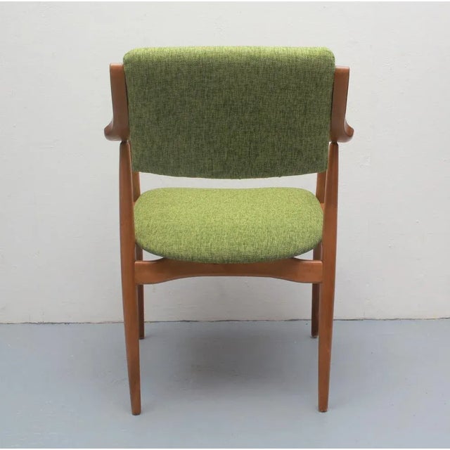 Elegant 60s armchair. Solid beech wood construction. Freshly upholstered and newly covered. Upholstery fabric in shades of...
