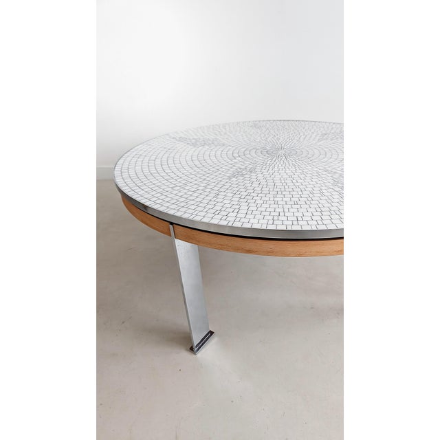 Round mosaic coffee table by German sculptor Berthold Müller, featuring a wooden and metal construction with four chromed...