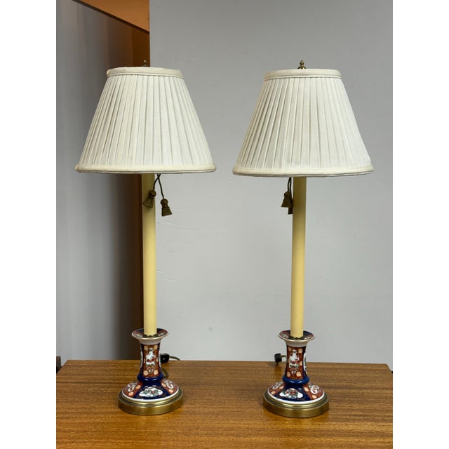 Design Plus Gallery presents a Pair of Imari Style Tall Candlestick Table Lamps from Frederick Cooper. The lamps have an...