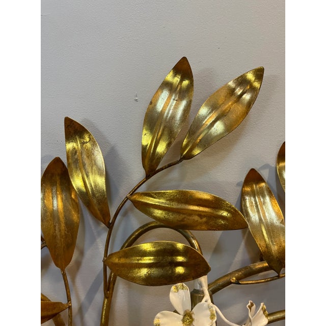 Vintage Hans Kögl gilt and tole floral wall light, a radiant mid-century statement in Hollywood Regency stole A striking...