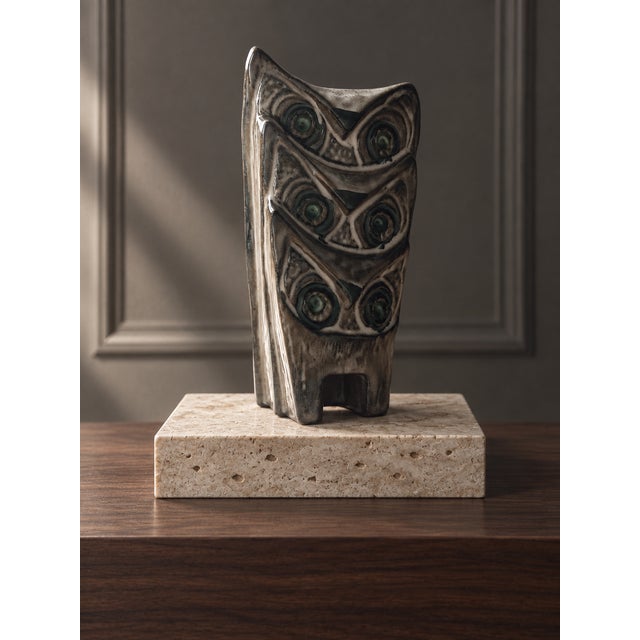 A sculptural Mid-Century Modern ceramic composition by Ester Wallin for Upsala-Ekeby, Sweden, depicting three stacked owls...