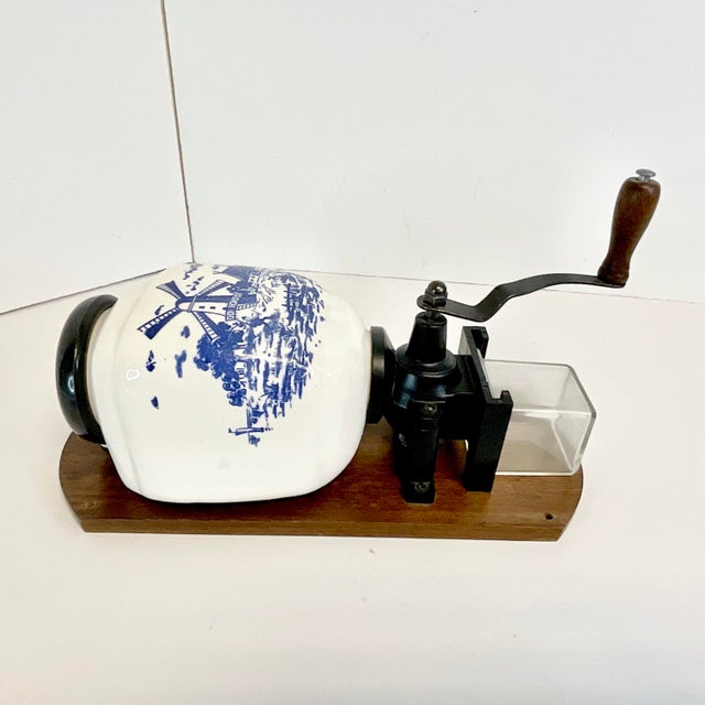 A delightful Delft Ceramic Wall Mounted Coffee Grinder. This is from the 1940s and features a Holland Wind Mill motif....