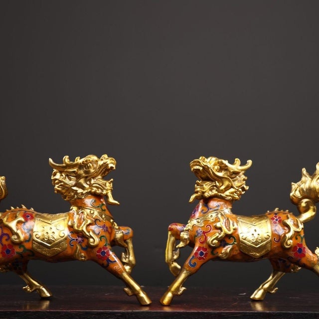This is a striking pair of vintage Qilin (also known as "Kirin" or Chinese unicorn) statues, crafted from bronze with...