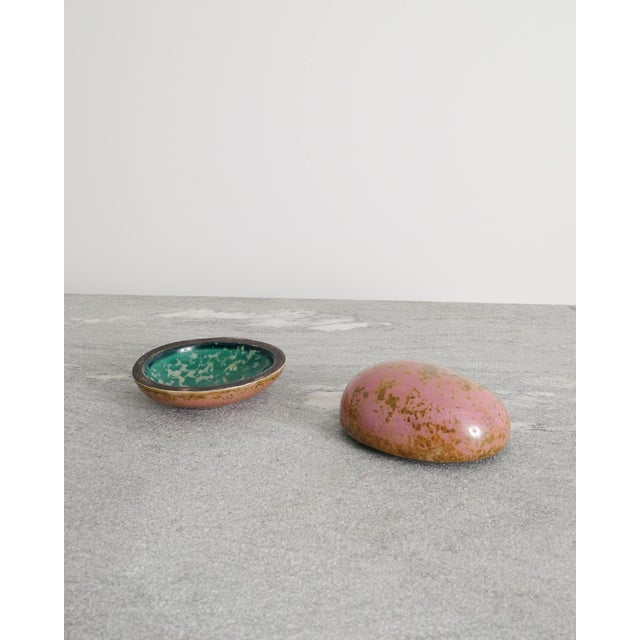A rare and small decorative swedish mid century pink and yellow glazed stoneware box with a green inside by the swedish...