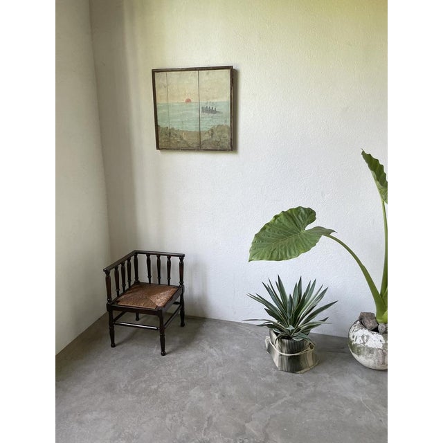 Old straw chair and very elegantly turned oak structure, known as “fireside chair”. This chair has a unique design, with...