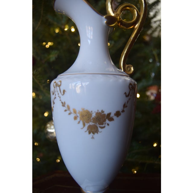 Elegant early 20th century porcelain ewer-form vase by AK Kaiser. The slender classical body is finished in a luminous...