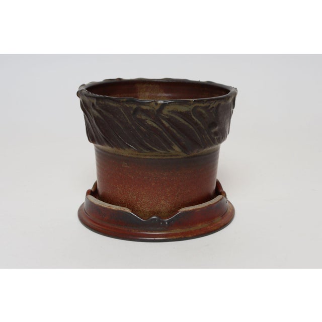 Studio ceramic planter with plate/display stand by ceramicist, Deanna Nichols (b. 1942-2017, Missouri). Holding a BFA from...