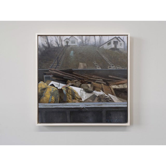 Rehab, 2025 presents a stark juxtaposition between the debris in the foreground and the modest houses on the hill in the...