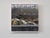 Rehab, 2025 presents a stark juxtaposition between the debris in the foreground and the modest houses on the hill in the...
