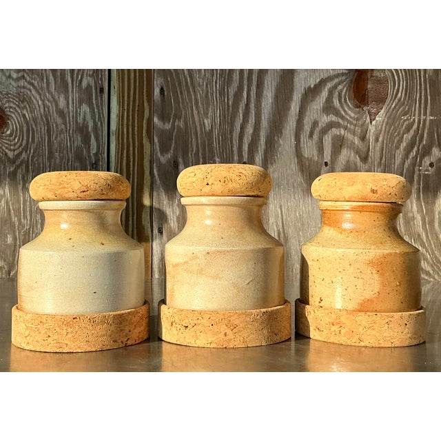 This set of vintage boho studio pottery jars exudes natural elegance and rustic charm. Each jar features a warm, earthy...