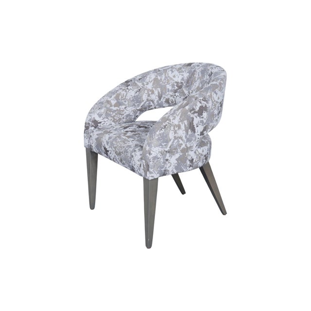 A contemporary upholstered Melone side chair designed by Stanley Jay Friedman for Lazar of North Carolina. Sculptural...