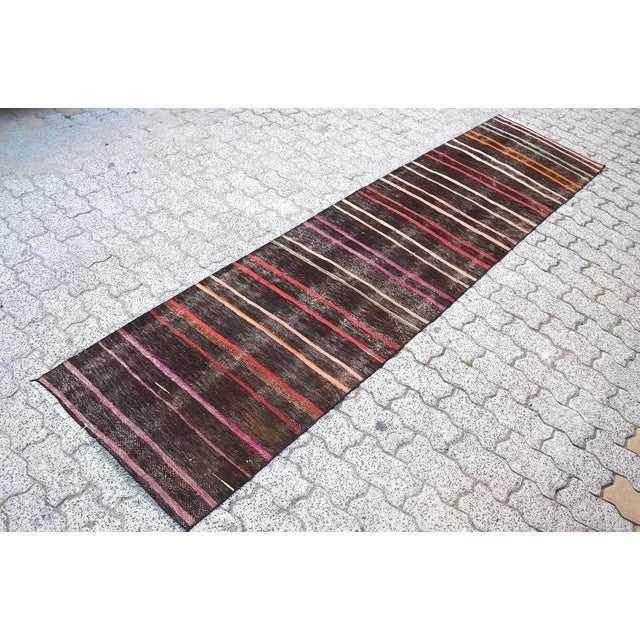 This is a vintage Turkish Oushak rug from the 1960s. The piece was hand-knotted.