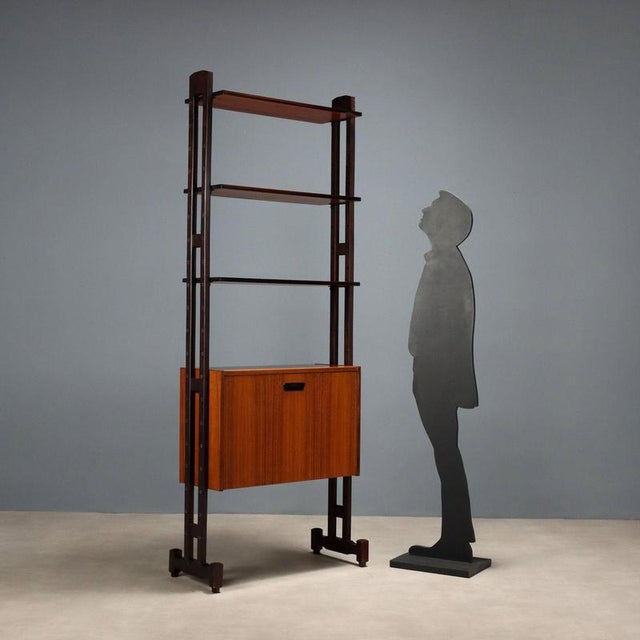 Freestanding bookcase, also usable as a freestanding unit, with adjustable open shelves and storage, and drop-down...