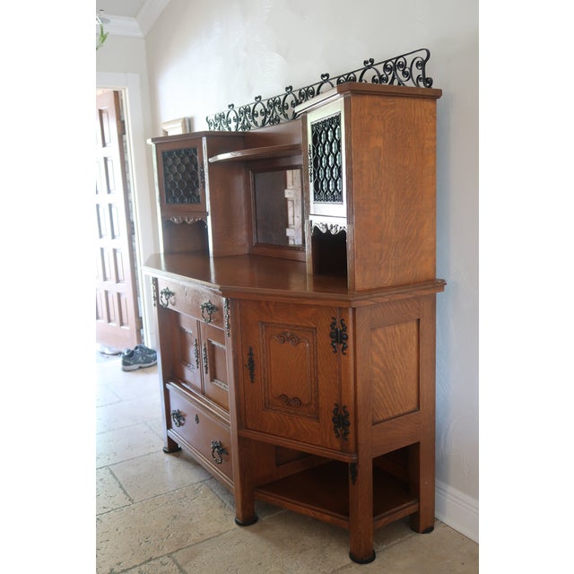 This is a vintage carved oak wood hutch. It can be a two piece set which is what really adds to the uniqueness. The top...