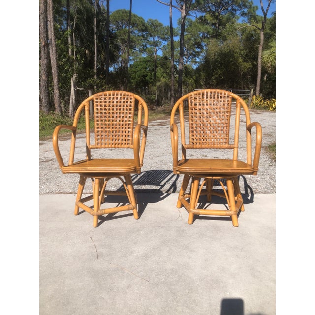 Midcentury Rattan Swivel Arm Chairs Set of 2 is a fabulous find! The chairs are sturdy and swivel without issue. It does...
