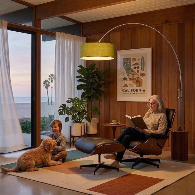 Designed by Peter Morelli in 1984, the Tambo Arc Lamp is a Mid-Century Modern masterpiece featuring satin nickel and a...