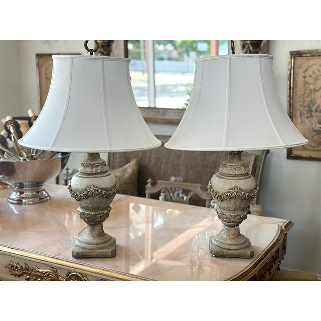 This is a pair of matching concrete balustrade table lamps from the 20th century. These lamps feel sturdy and substantial,...