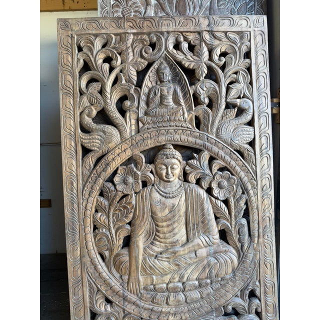 Bring a sense of serenity and timeless craftsmanship into your home with this antique hand-carved solid wood Buddha wall...
