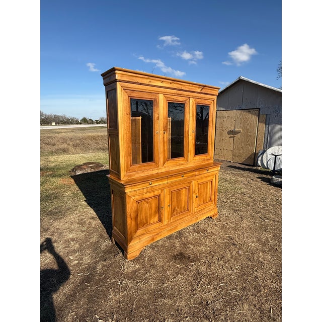 This elegant 19th-century French bookcase is a striking example of classic craftsmanship and timeless design. Made from...