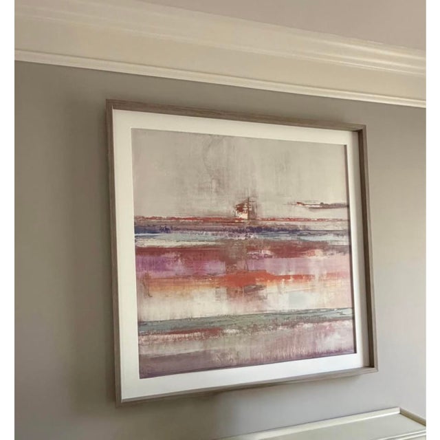 Oversized framed abstract artwork featuring layered washes of blush, mauve, dusty rose, rust, muted blue, gray and soft...