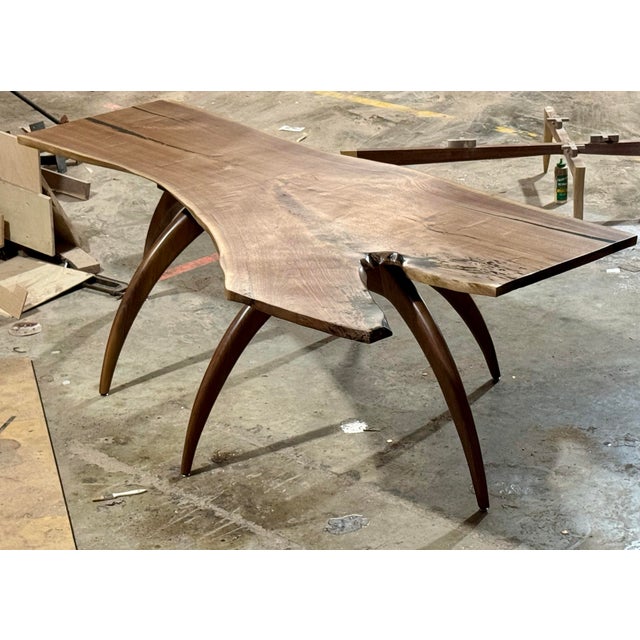 This one-of-a-kind custom dining table is handcrafted by artist and woodworker Larry Jerome using solid American black...