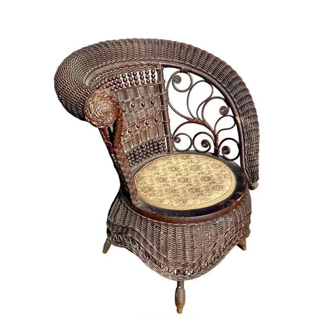 Jenkins & Phipps stick and ball wicker photographers or portrait chair with asymmetrical scrolled right arm and...