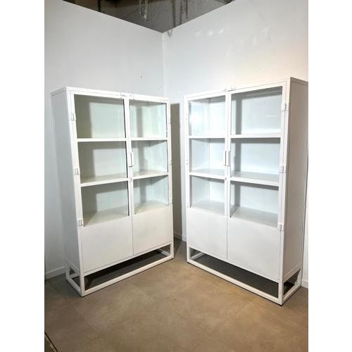 Minimal and practical, this white metal cabinet combines a sleek industrial look with plenty of storage. The upper section...