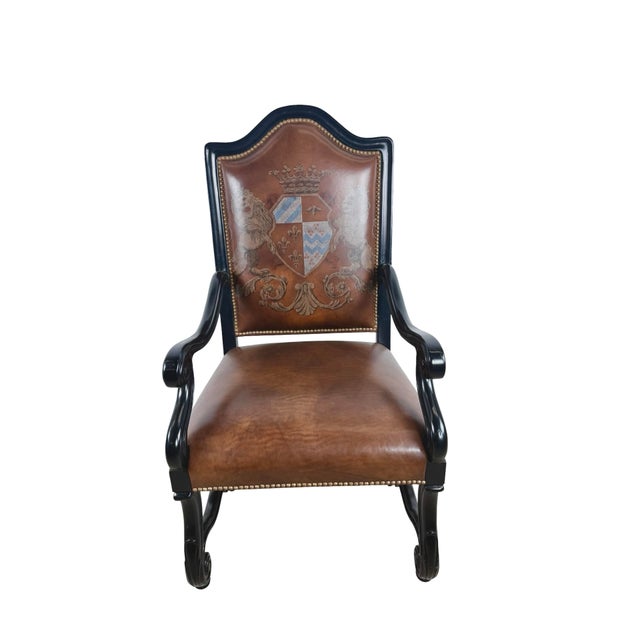 A dramatic Ferguson Copeland armchair from the maker’s European Country collection, combining carved wood, leather...