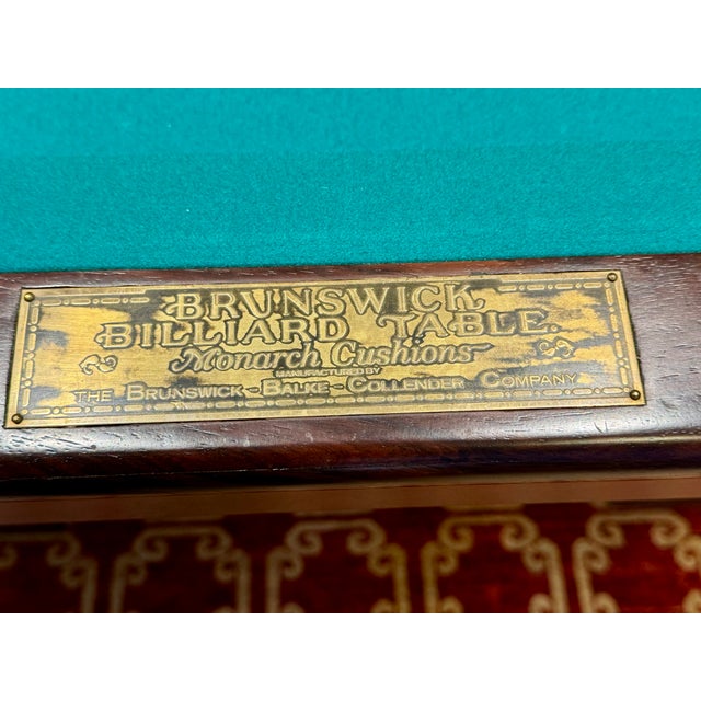 A magnificent example of early 20th-century American craftsmanship, this Brunswick "Rochester" pool table represents one...