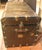Late 19th century steamer trunk, American. Wood, canvas, leather & brass studding all combine to make a unique end table,...