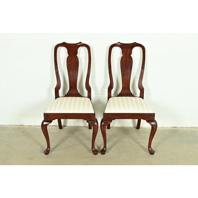 An outstanding pair of Queen Anne or Georgian style side chairs or dining chairs By Henkel Harris USA, Circa 1980s Solid...